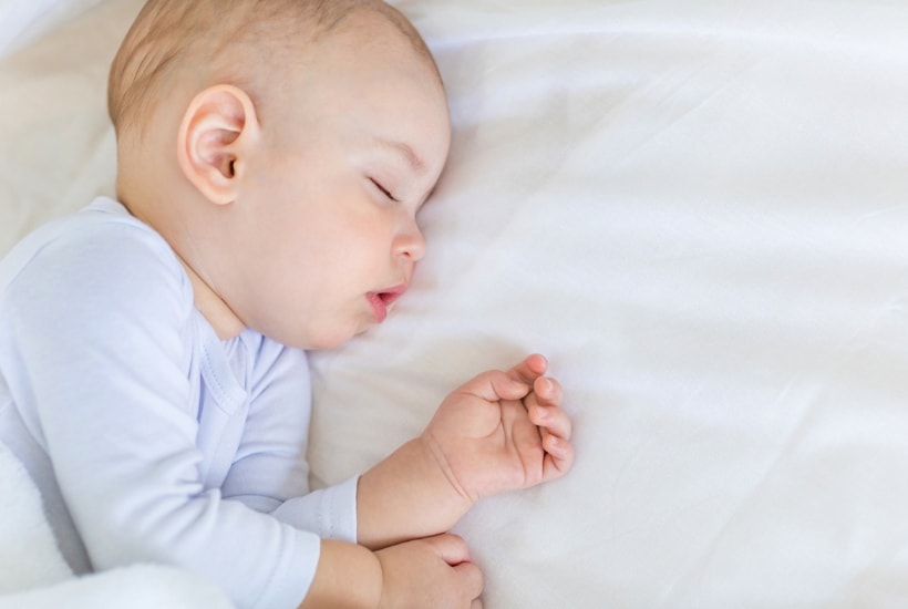 picture of baby sleeping to help prepare moms with what to expect with a newborn